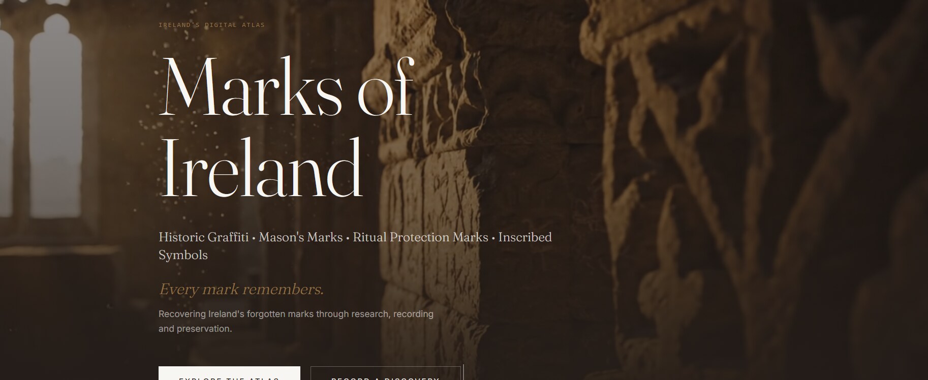 Marks of Ireland digital atlas homepage showing an inscribed medieval stone wall and Gothic window